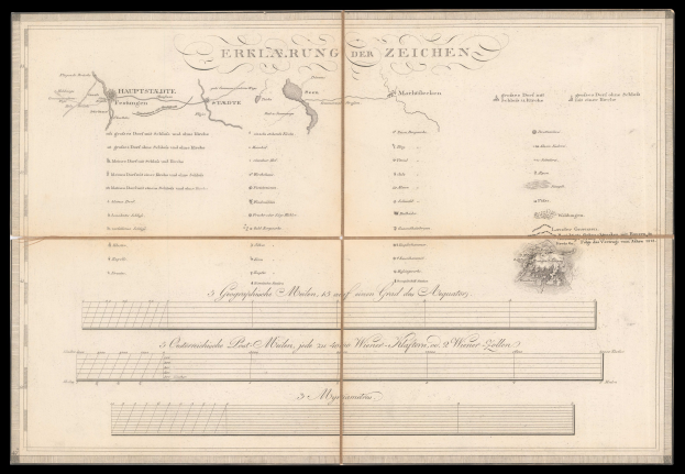 Ein offenes Buch mit schwarzem Einband, das eine Deutschlandkarte zeigt und Text und eine Zeichnung enthält.