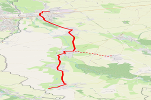 Eine detaillierte Stadtkarte mit einer roten Linie, die eine Radroute markiert, zeigt Straßen, Sehenswürdigkeiten und interessante Punkte.